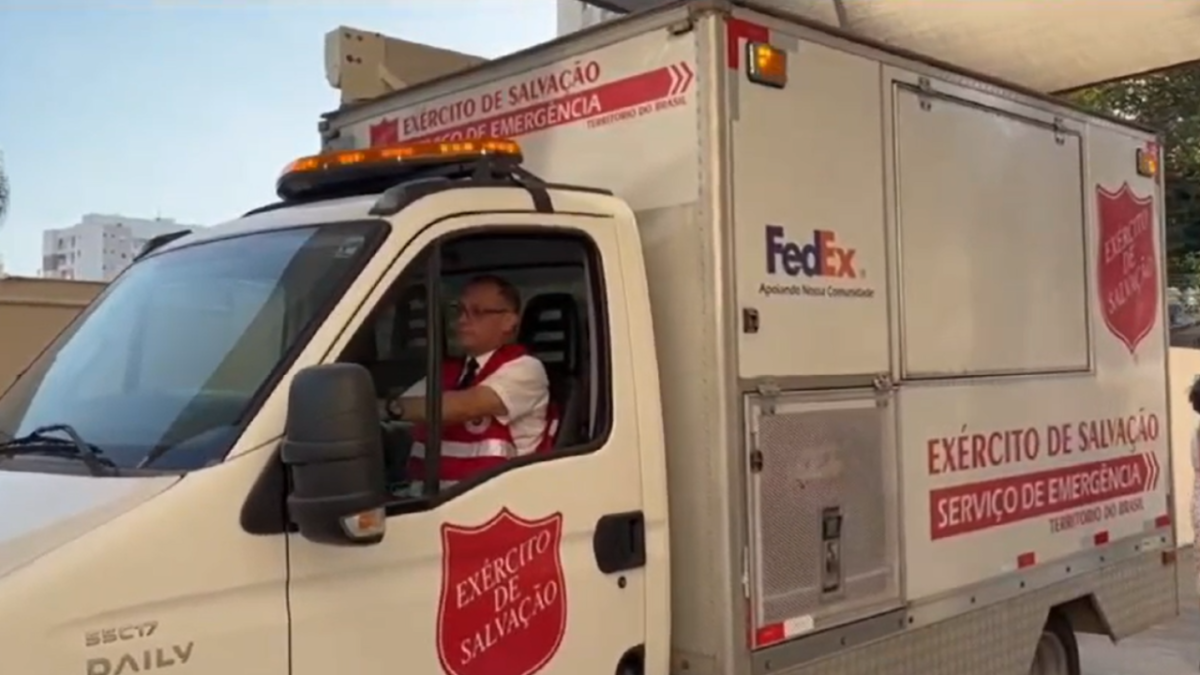 A person driving a Salvation Army FedEx vehicle