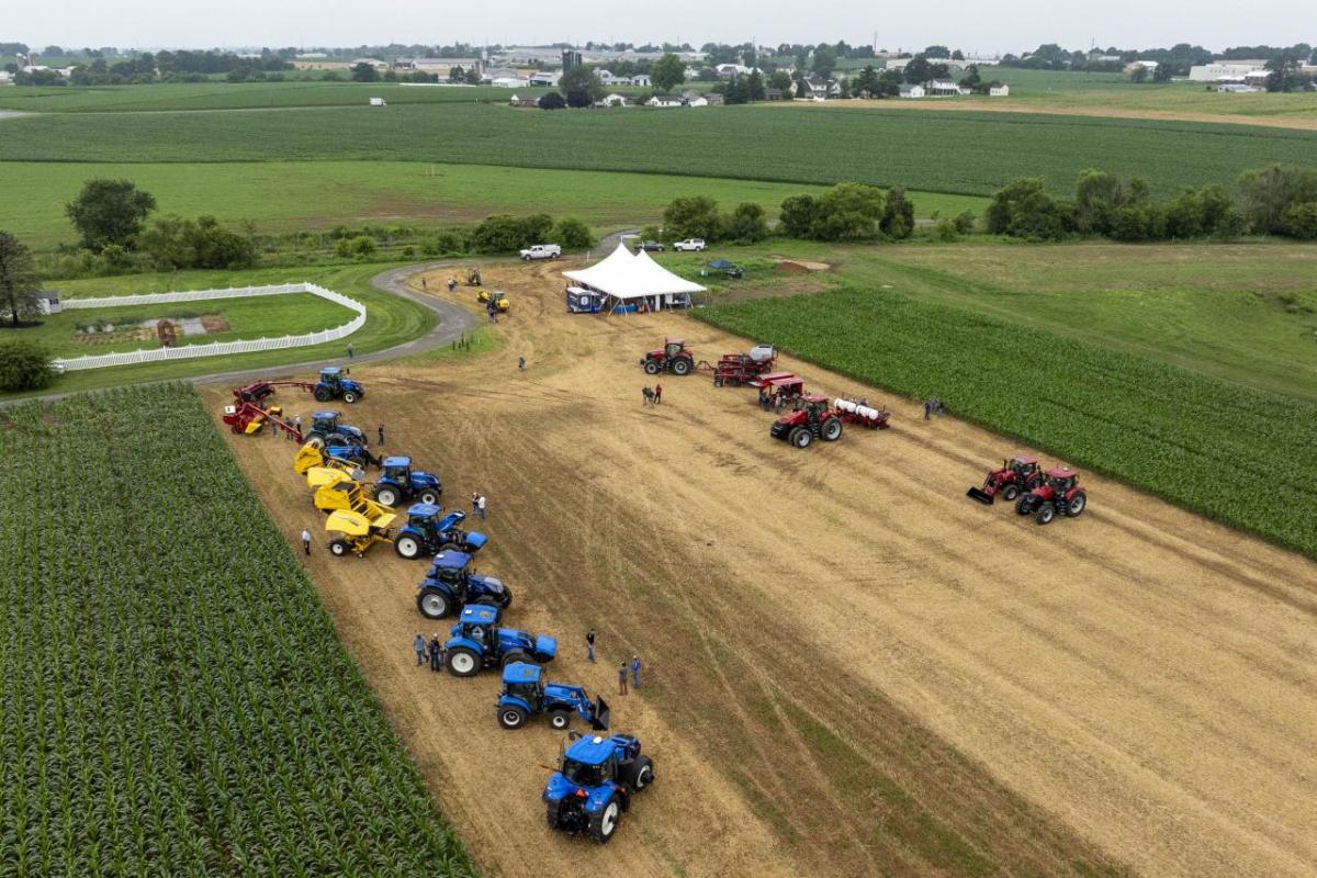 Aerial view of tractors and a tent