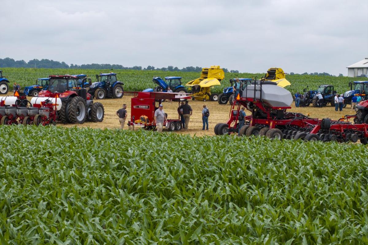 Tractors and people in a field