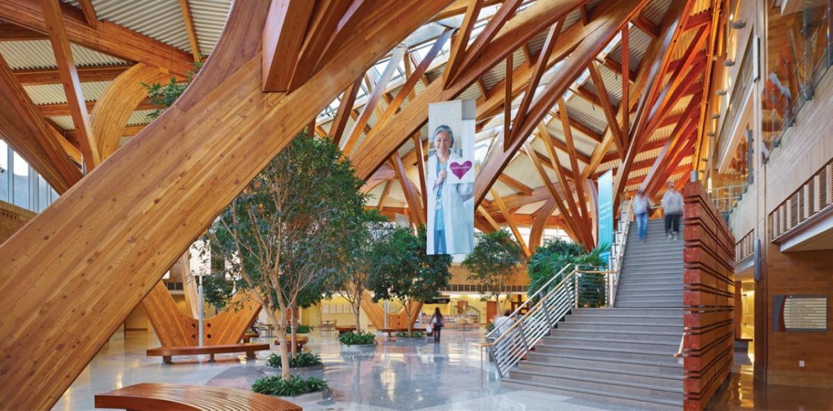 interior of exposed wooden-beamed hospital open area