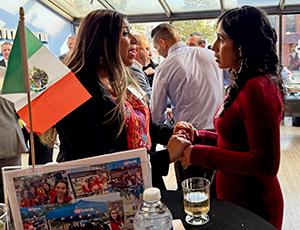 Two people talking at a networking reception