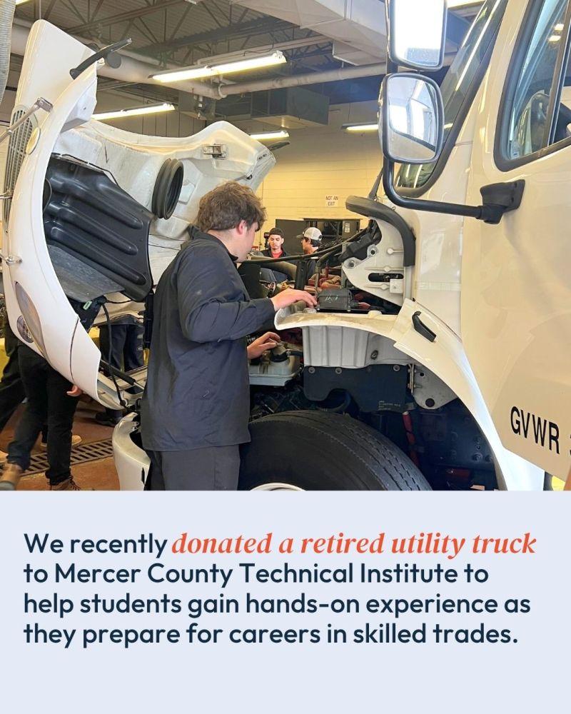 person examining truck engine