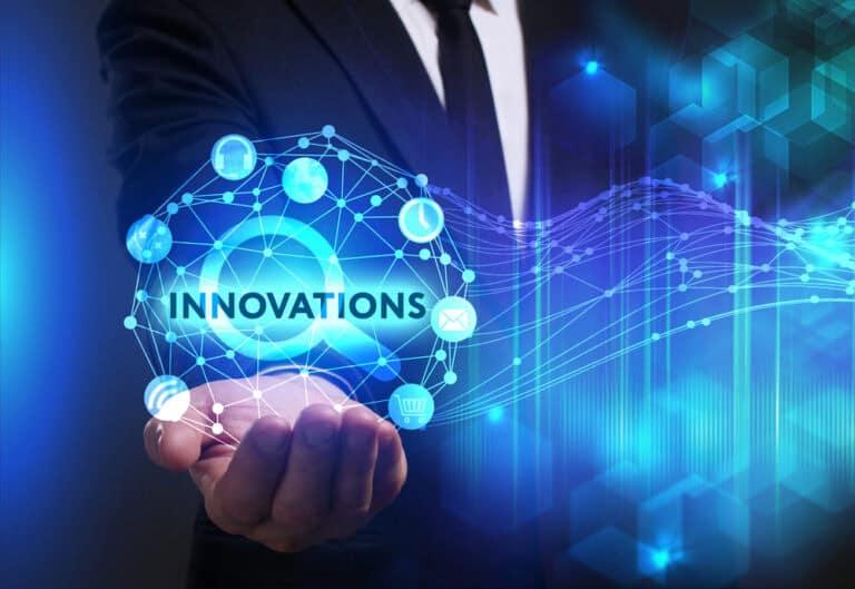 Image courtesy of RTInsights person holding a drawing of an orb with word "INNOVATIONS"
