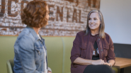 Julia White and Dayna Eberhardt talking.