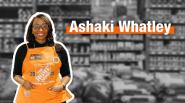 Ashaki Whatley, The Home Depot, shown smiling and wearing an orange apron.