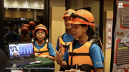 Instructor teaching students wearing safety gear