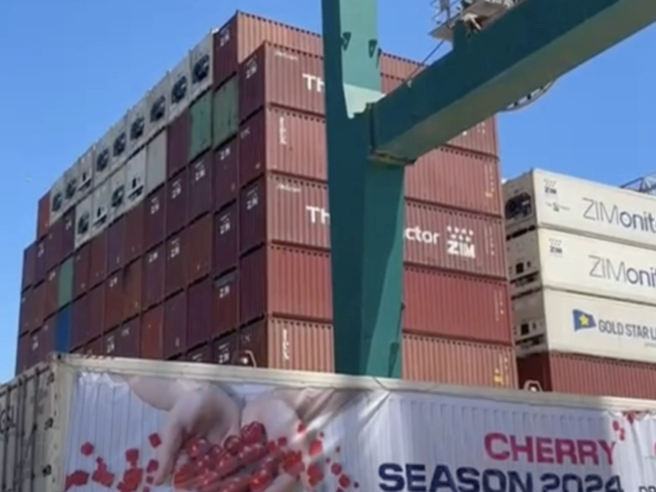 Shipping containers. One reads "Cherry Season 2024"