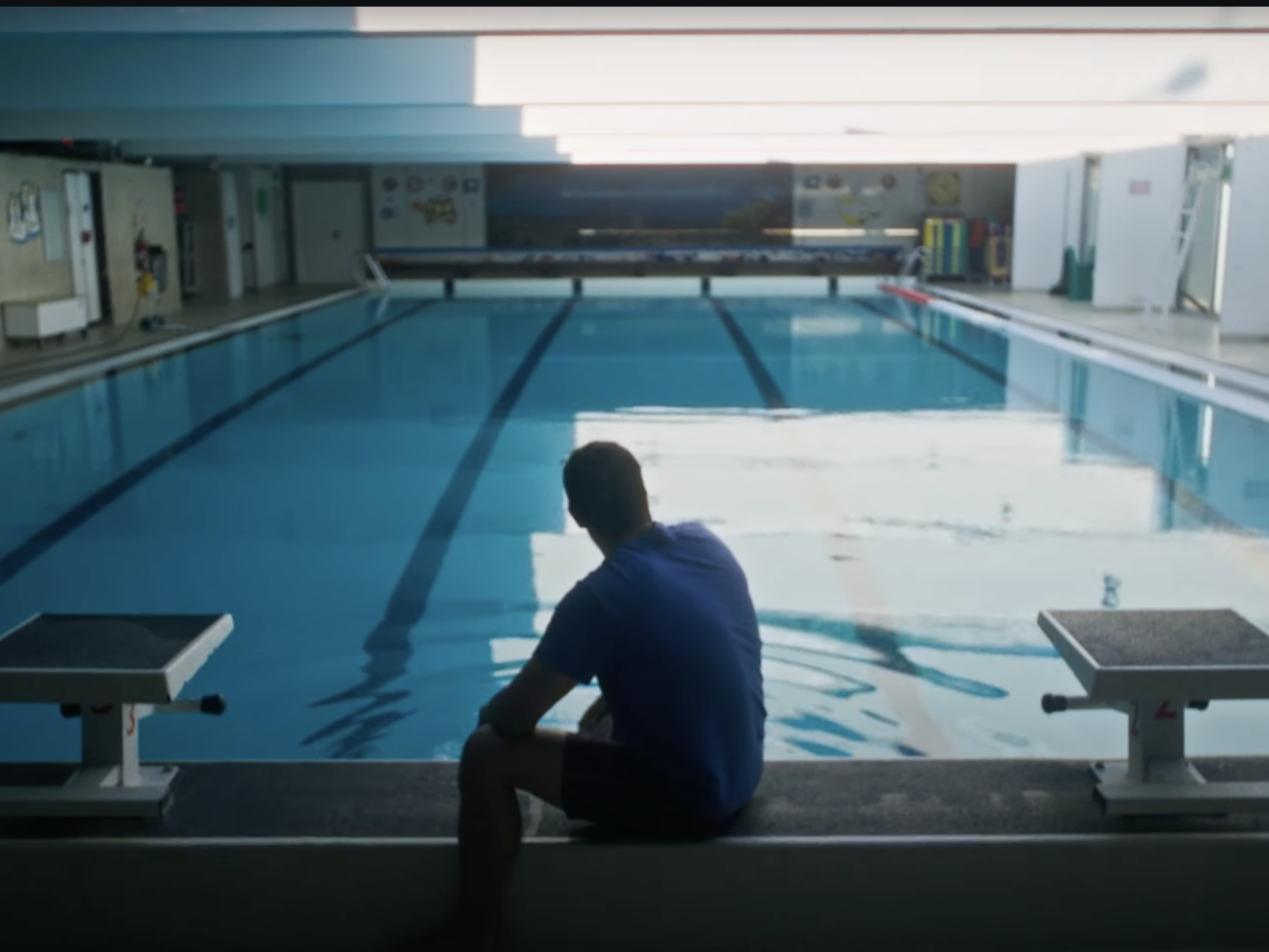 person in front of swimming pool