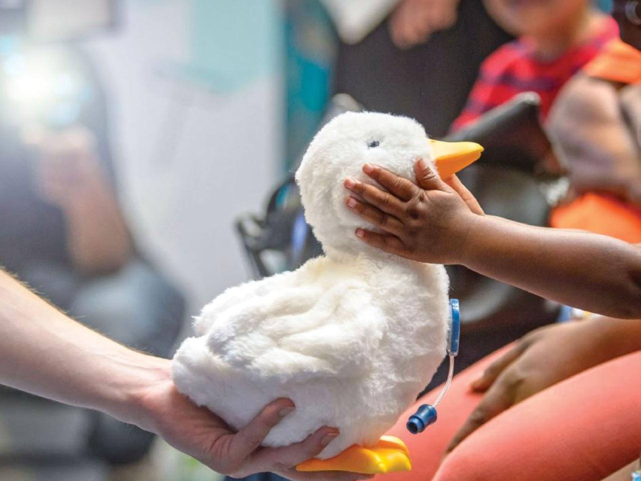 My Special Aflac Duck shown with children.