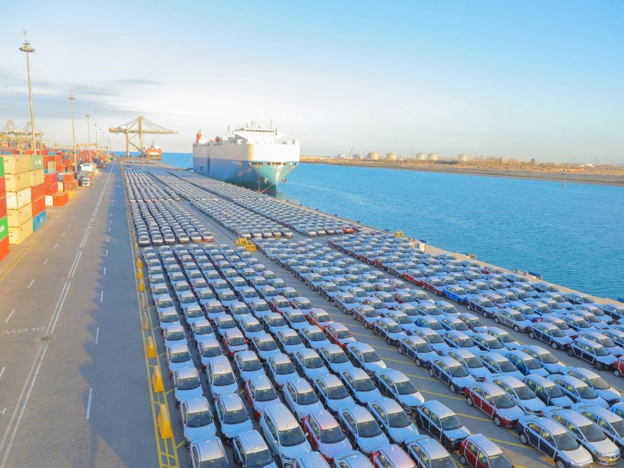 Rows of cars at port, ready to be shipped
