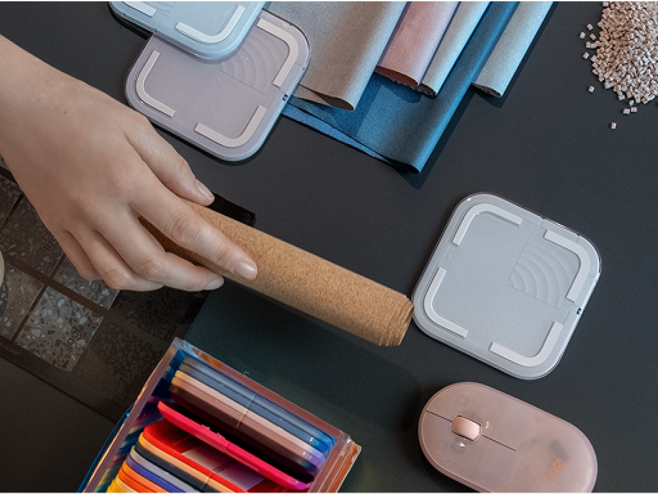 desk with hands and Logitech products shown on top
