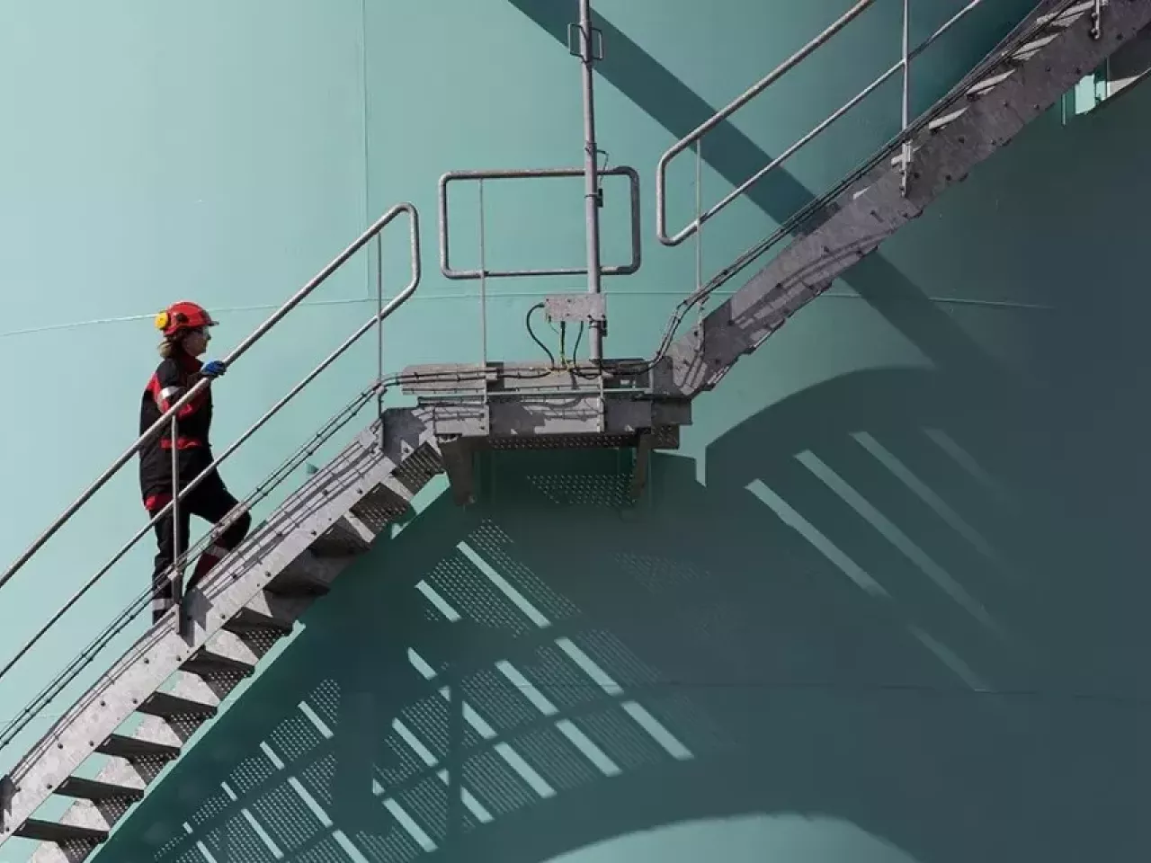 person walking up steps outside a building