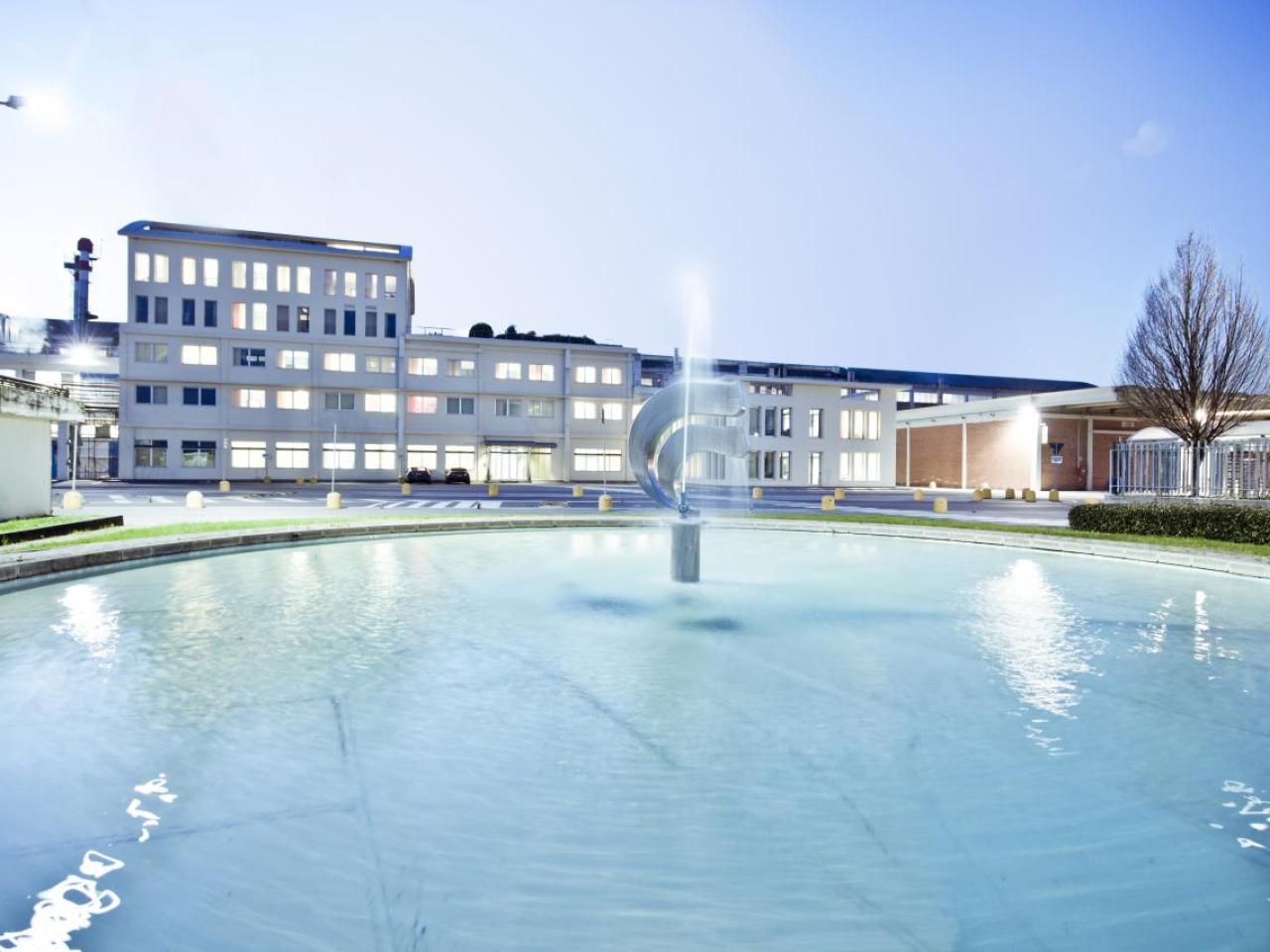 building with water feature in front
