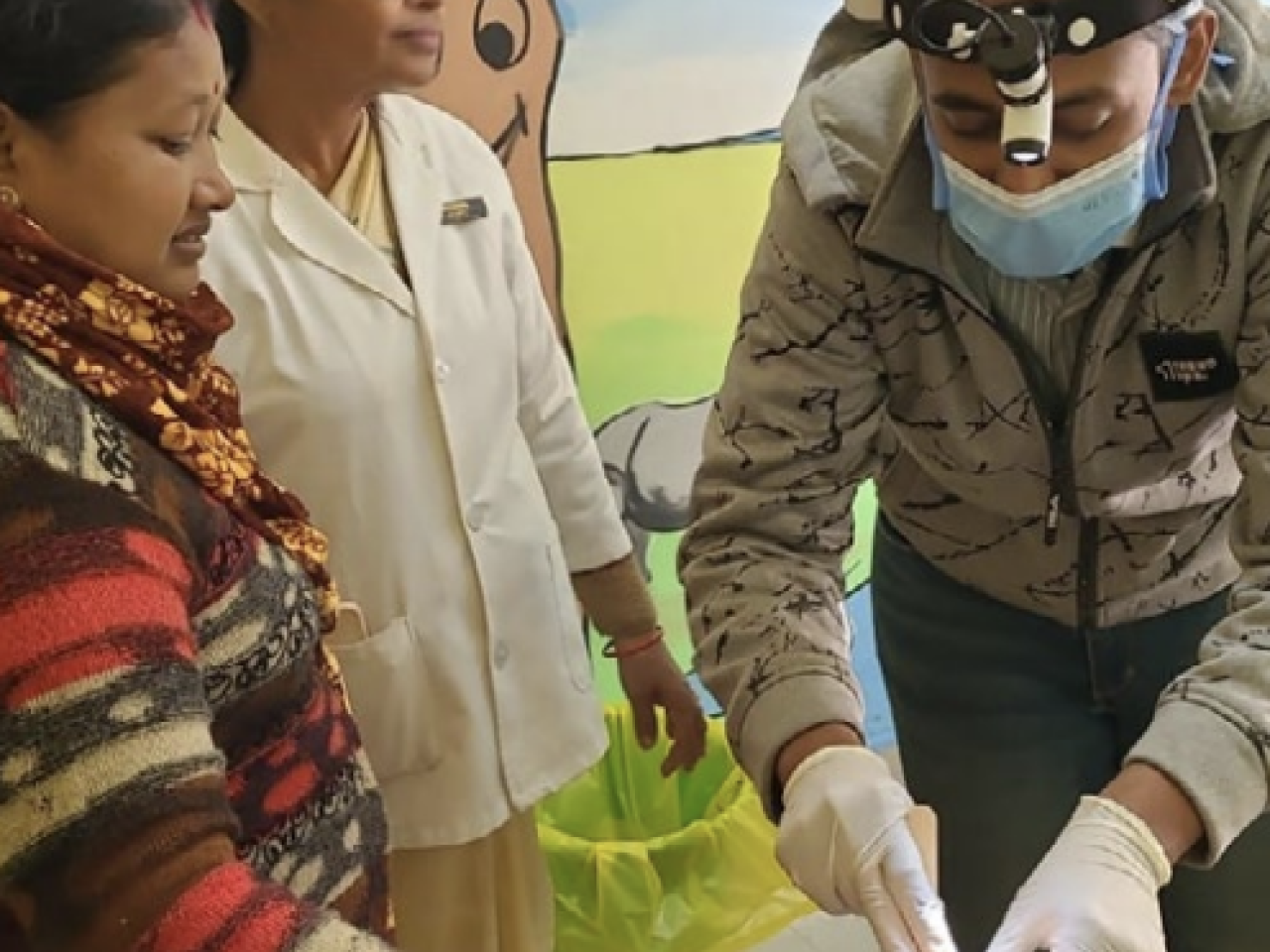 Healthcare professionals attending a patient 