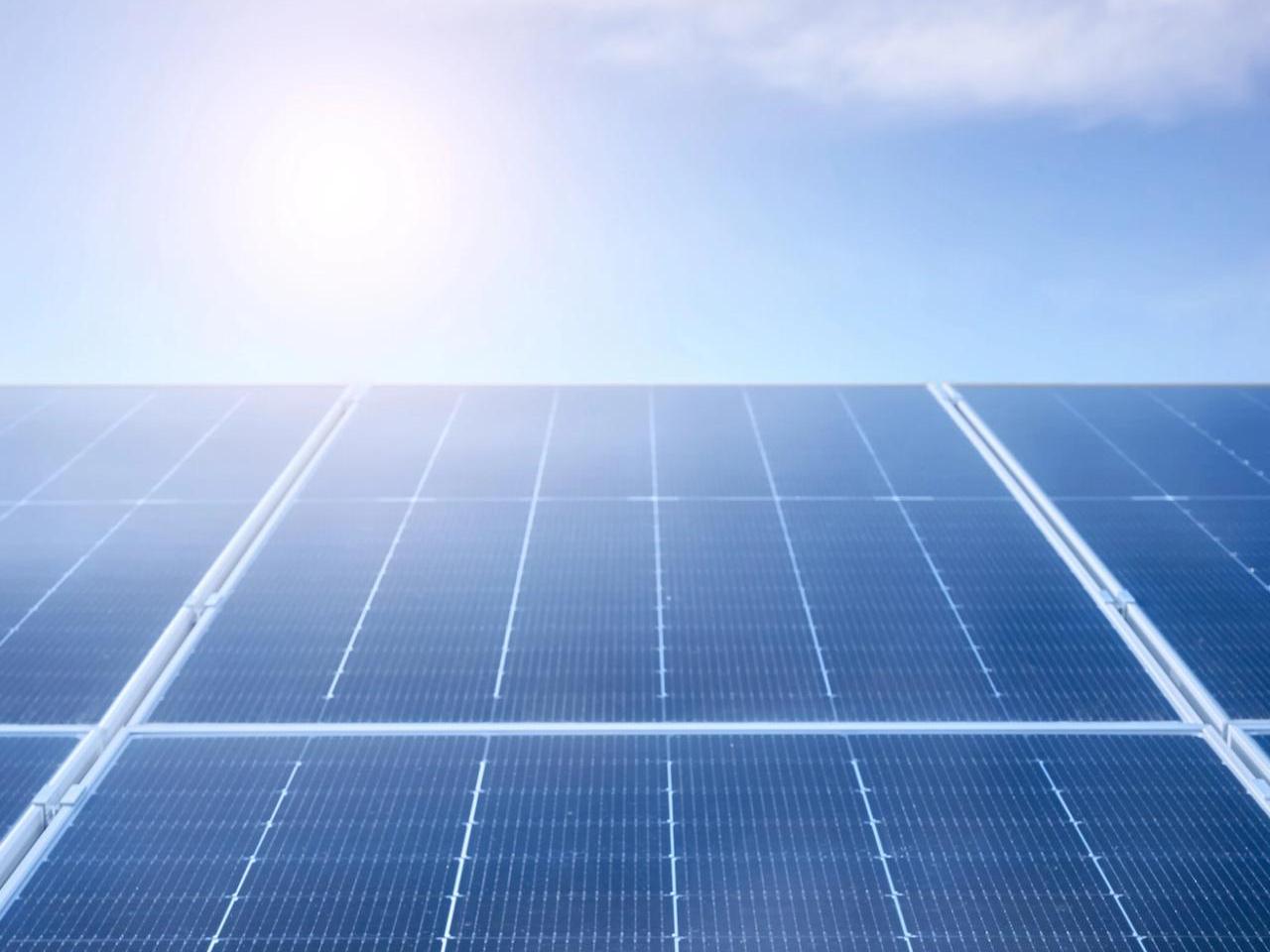 Looking towards the sky, a close up of solar panels.