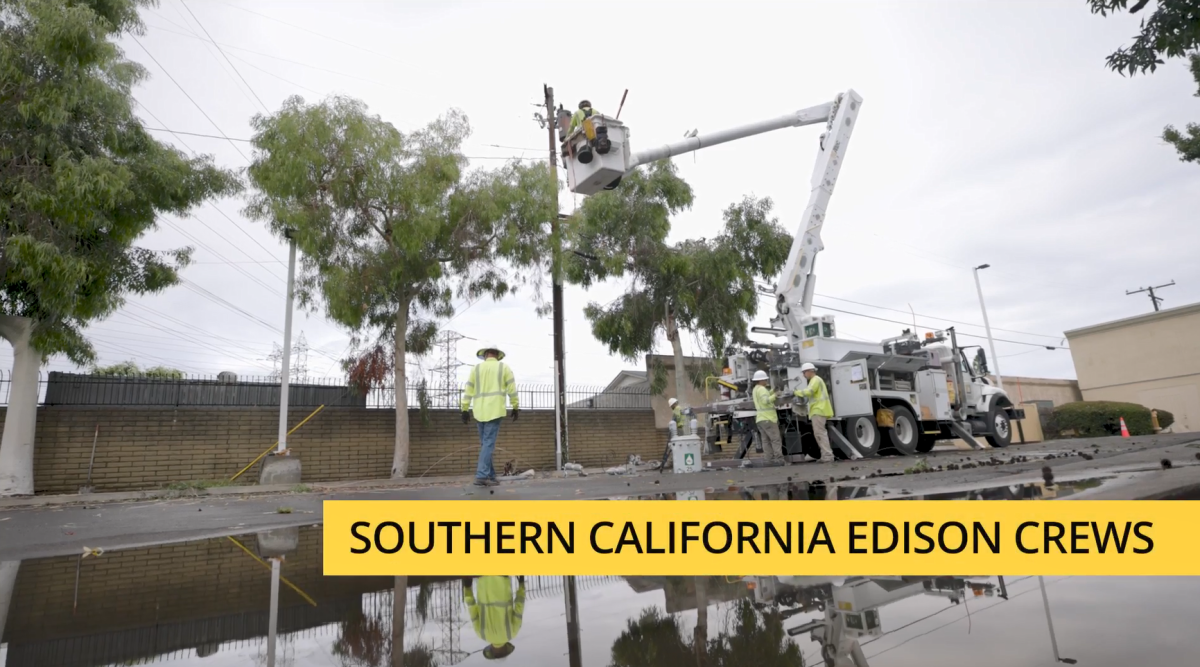 SCE crew and a bucket truck with person up high working on a line.