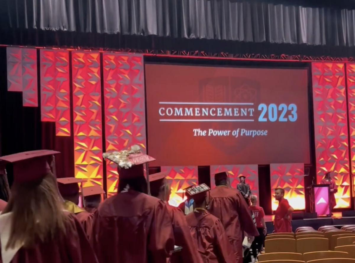 Graduates walking onto a stage
