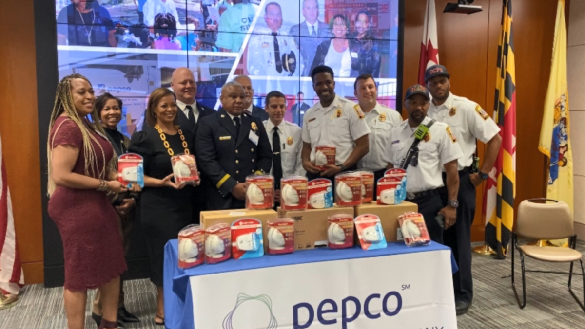 Group posed with donated smoke detectors.