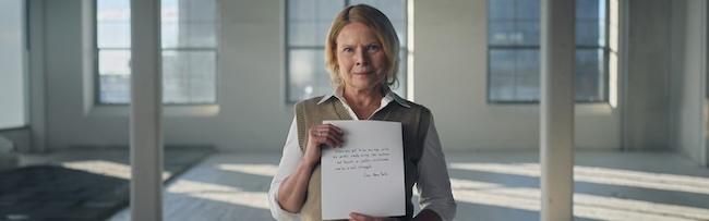 Gay holding her letter.