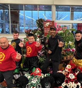 People posing at ACME store