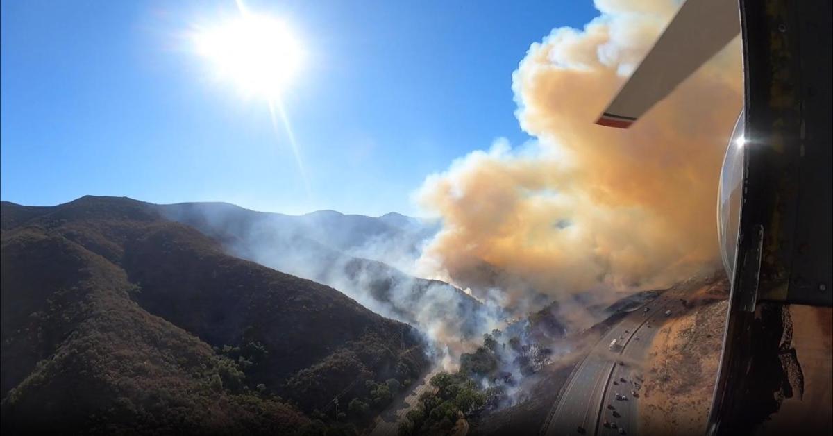 An S-76 helicopter and three helitankers patrol the Southern California skies