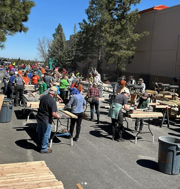 People working with lumber at the Sleep in Heavenly Peace event