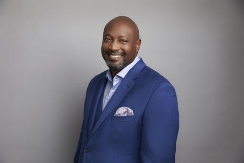 photo of David L Casey in a blue suit against a grey background