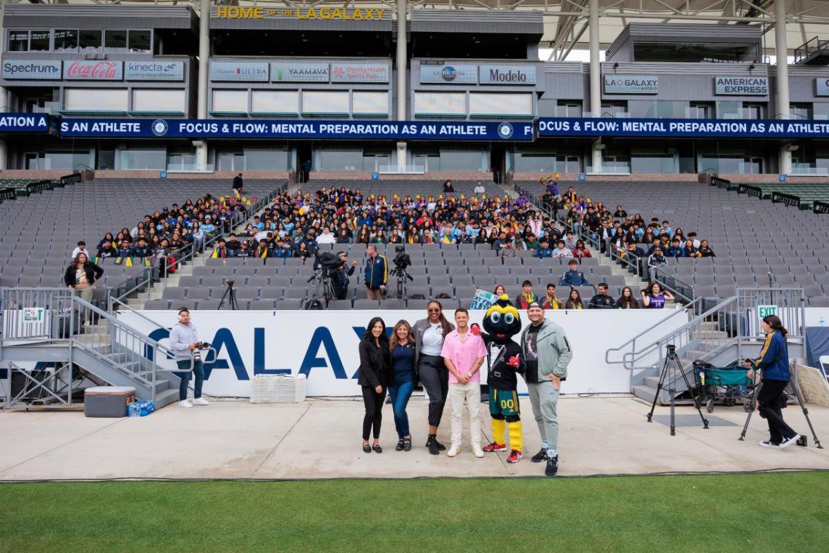 People standing together in front of an audience