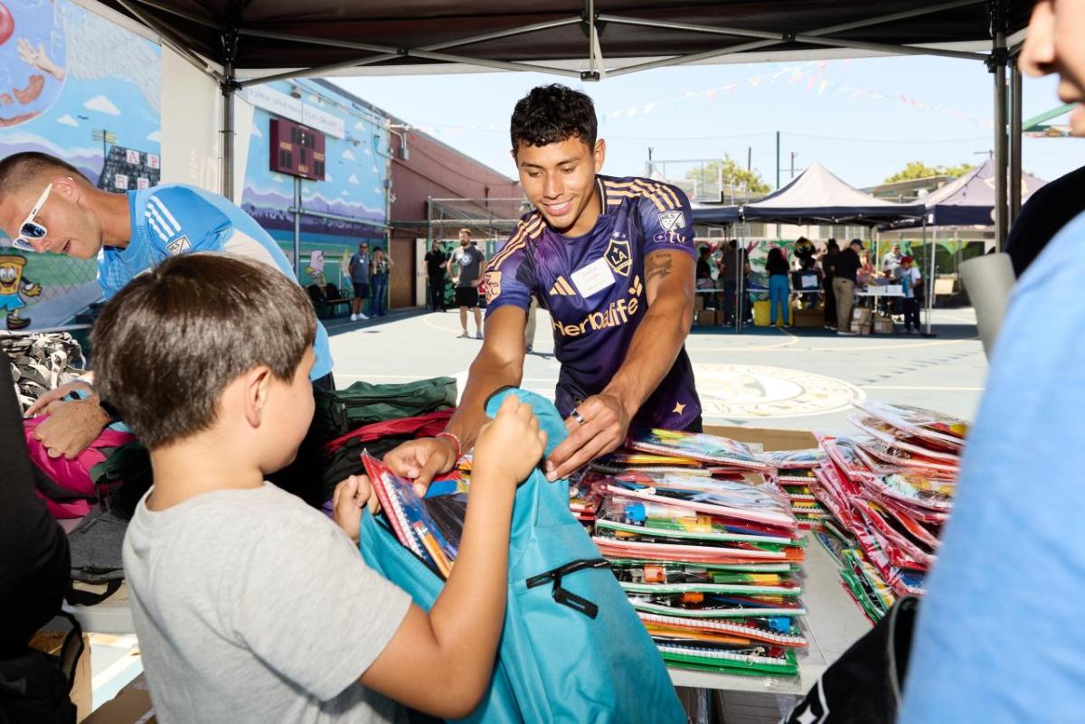 LA Galaxy midfielder Edwin Cerrillo helped hand out school supplies to students.