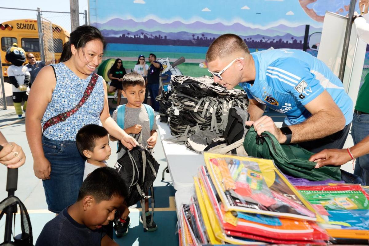 LA Galaxy's goalkeeper John McCarthy handed out school essentials to students for the upcoming academic year.