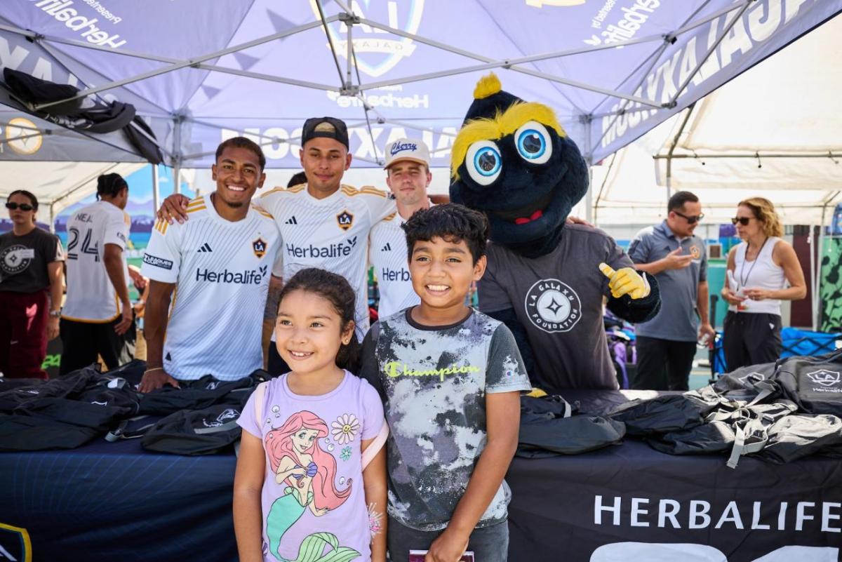 LA Galaxy players, staff and mascot Cozmo helped students in South LA get ready for the upcoming school year.