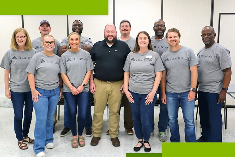 A group of people standing together in Regions Bank t-shirts