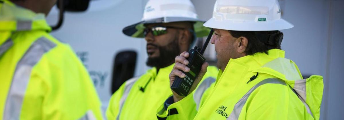 People in hard hats and reflective jackets