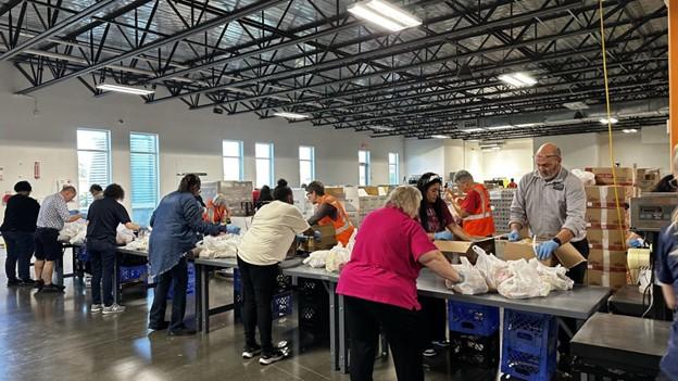 People packaging food into bags