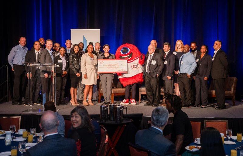 Group of people holding a check