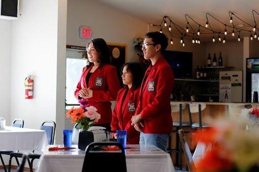 A group of people standing in a room