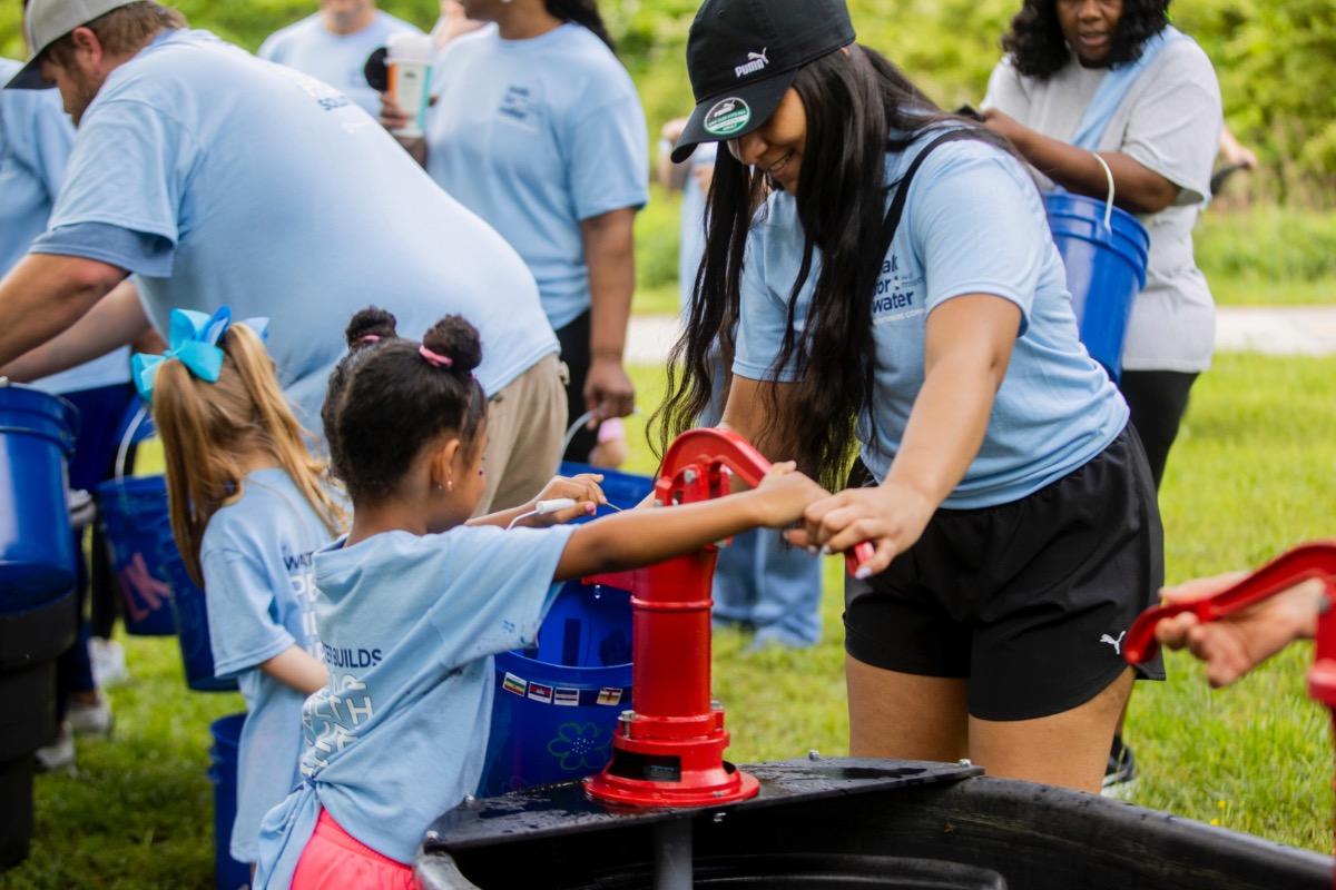 Pumping water at Walk for Water