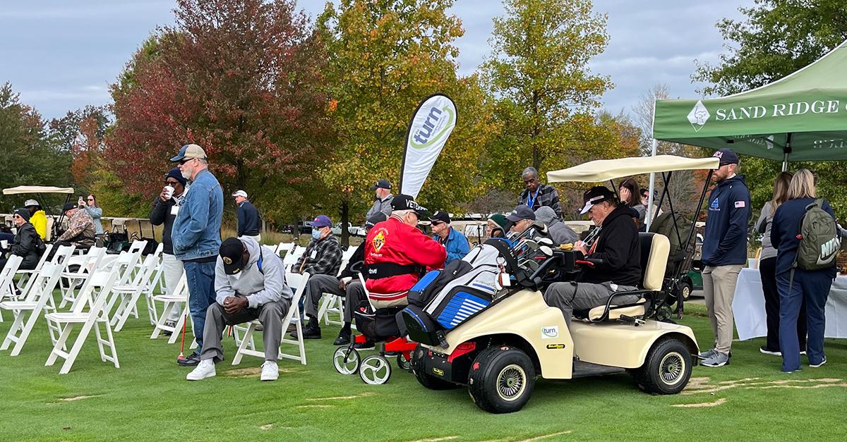 Participants, volunteers, and caregivers at the 2023 Stars, Stripes, and Links Event at Sand Ridge Golf Club in Chardon, Ohio.