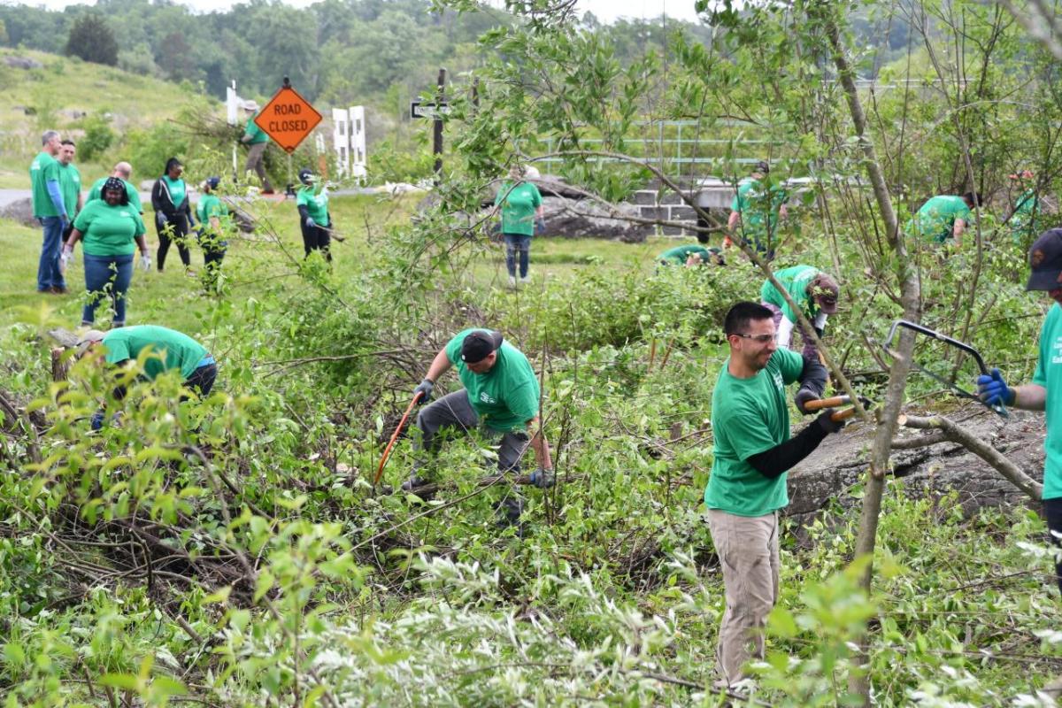 Volunteers helping to clean up and outdoor space 