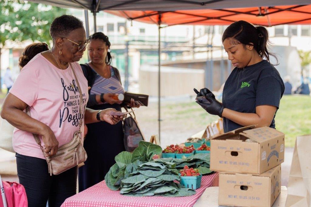 People buying fresh food