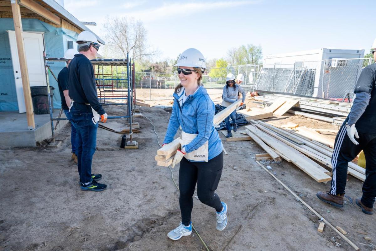 A person walking in a hardhat in a construction area