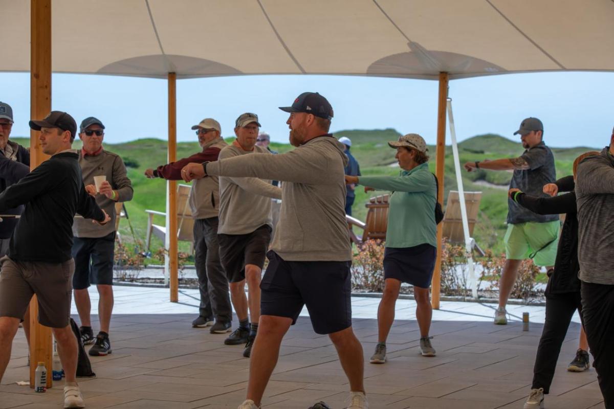 People doing exercises under a tent