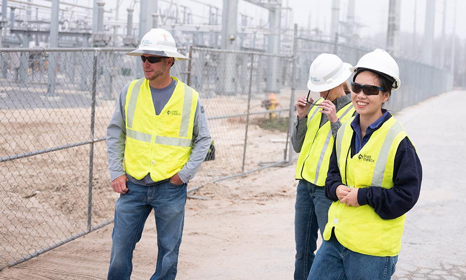 Wen Tong and two colleagues at a substation