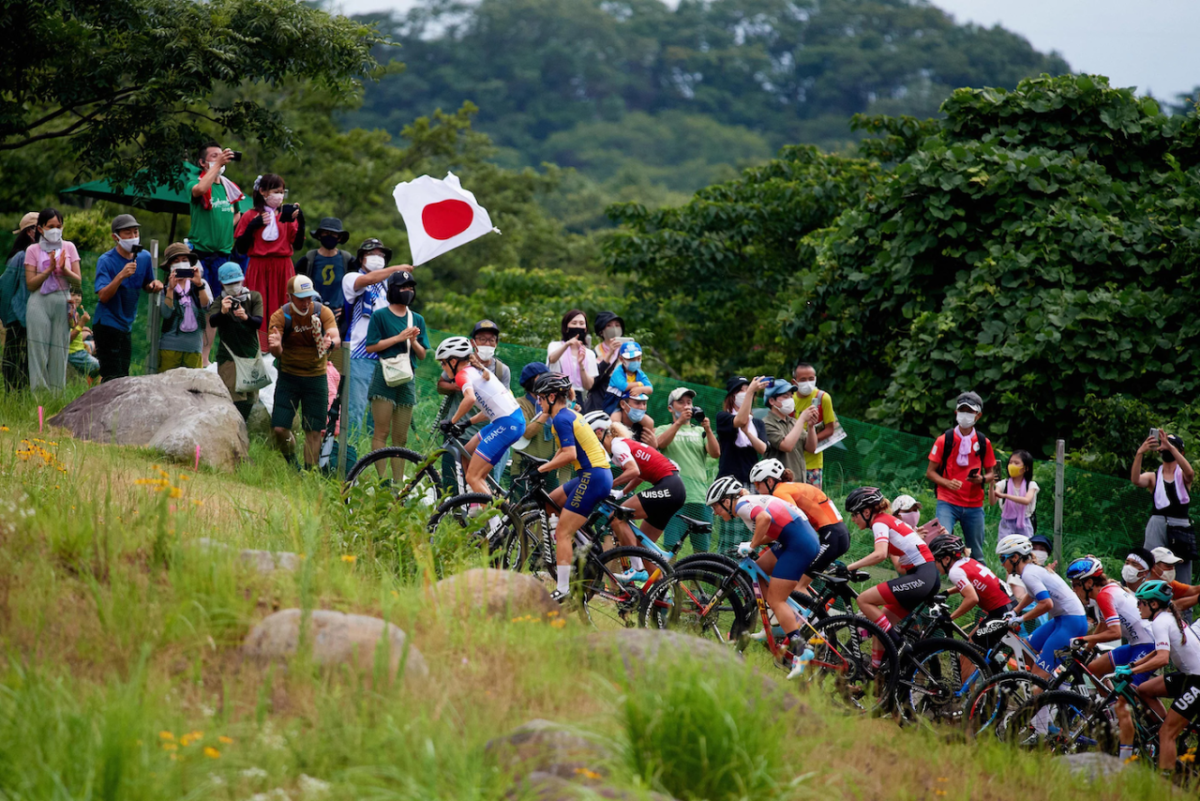 Bikers race up a hill