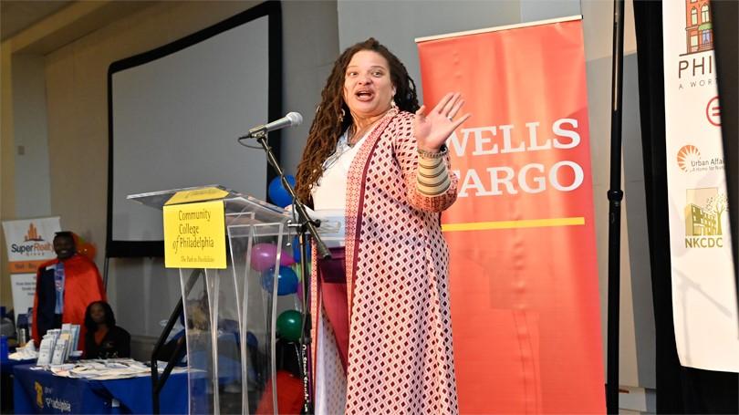 Women speaks at a podium