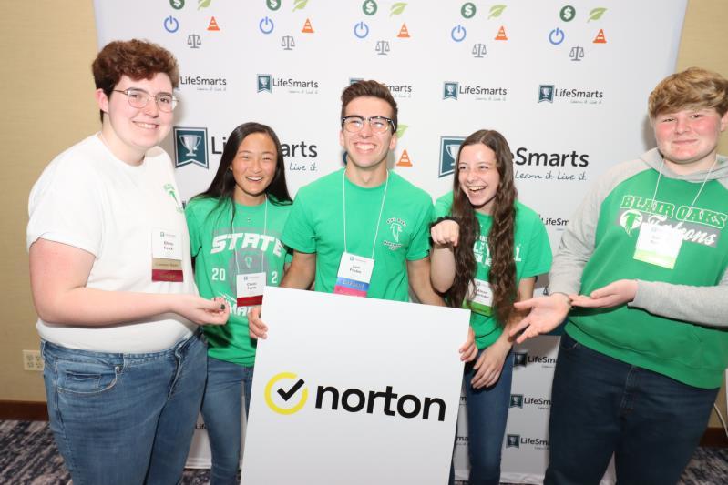 5 students holding a Norton sign