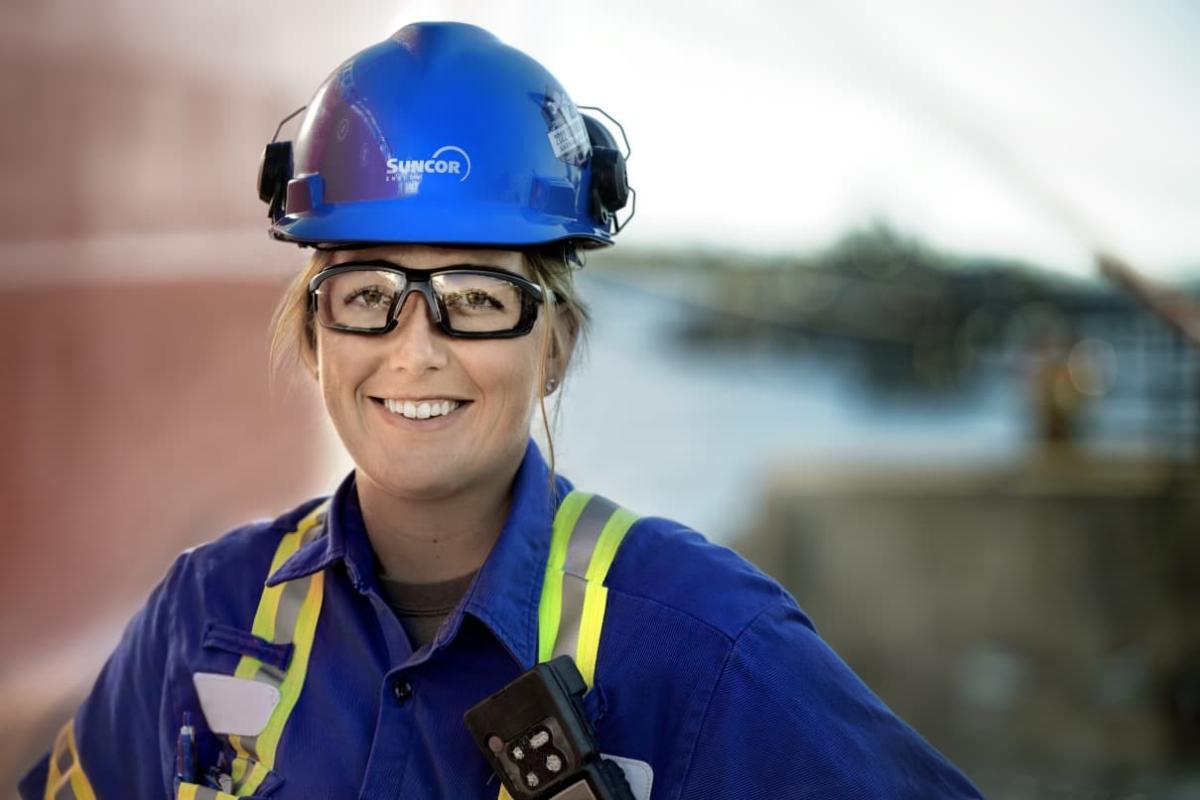 Person smiling while wearing work uniform