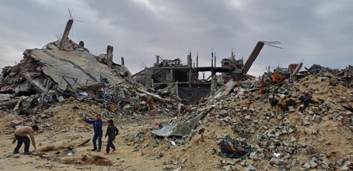 Children amongst sand and rubble