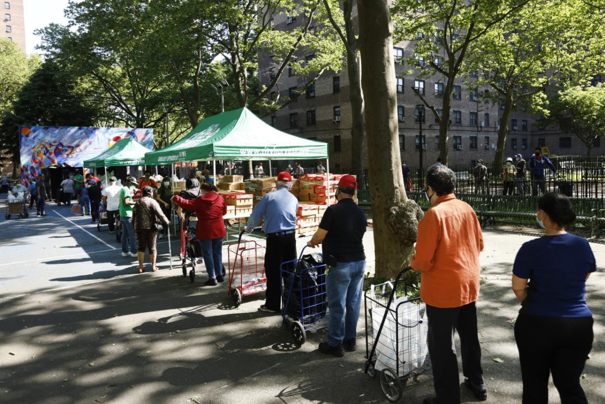 People waiting in line for food.