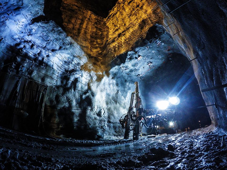 Inside a cave with mining equipment